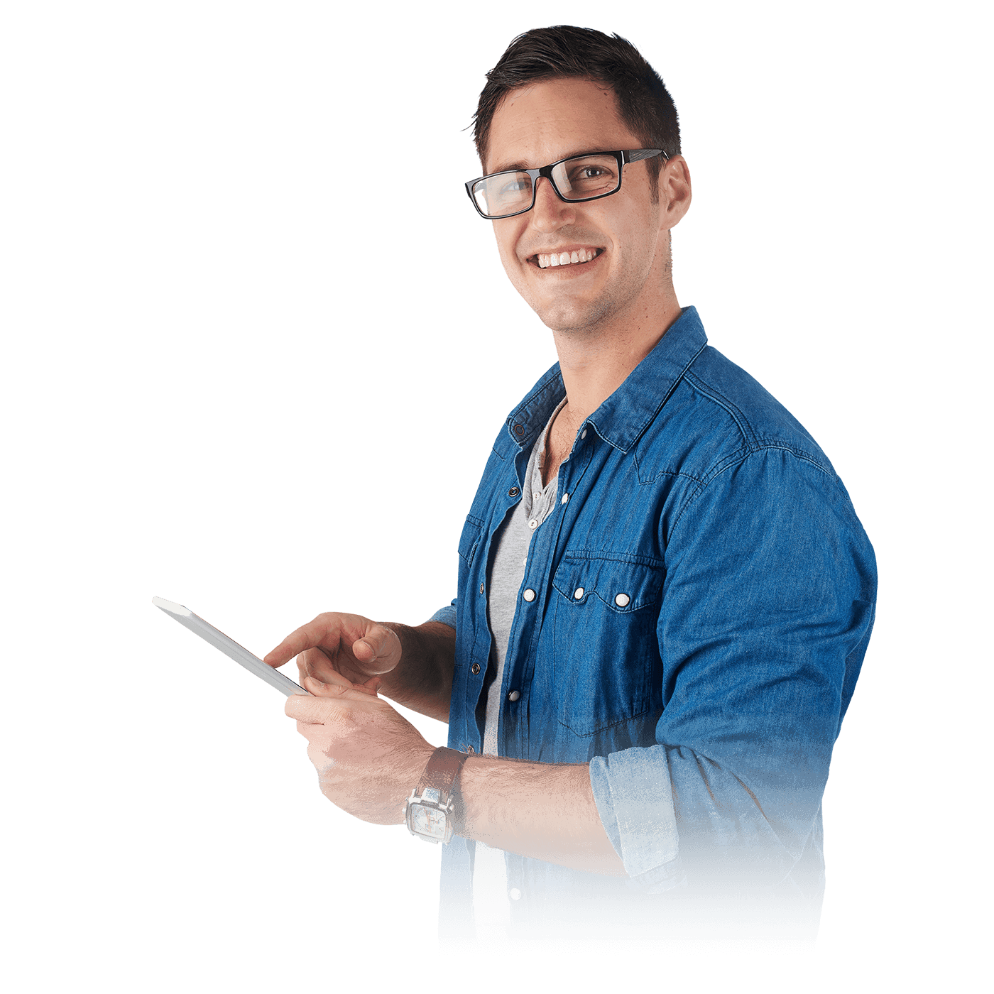 A man with spectacles in a blue overshirt smiling and using a mobile phone.