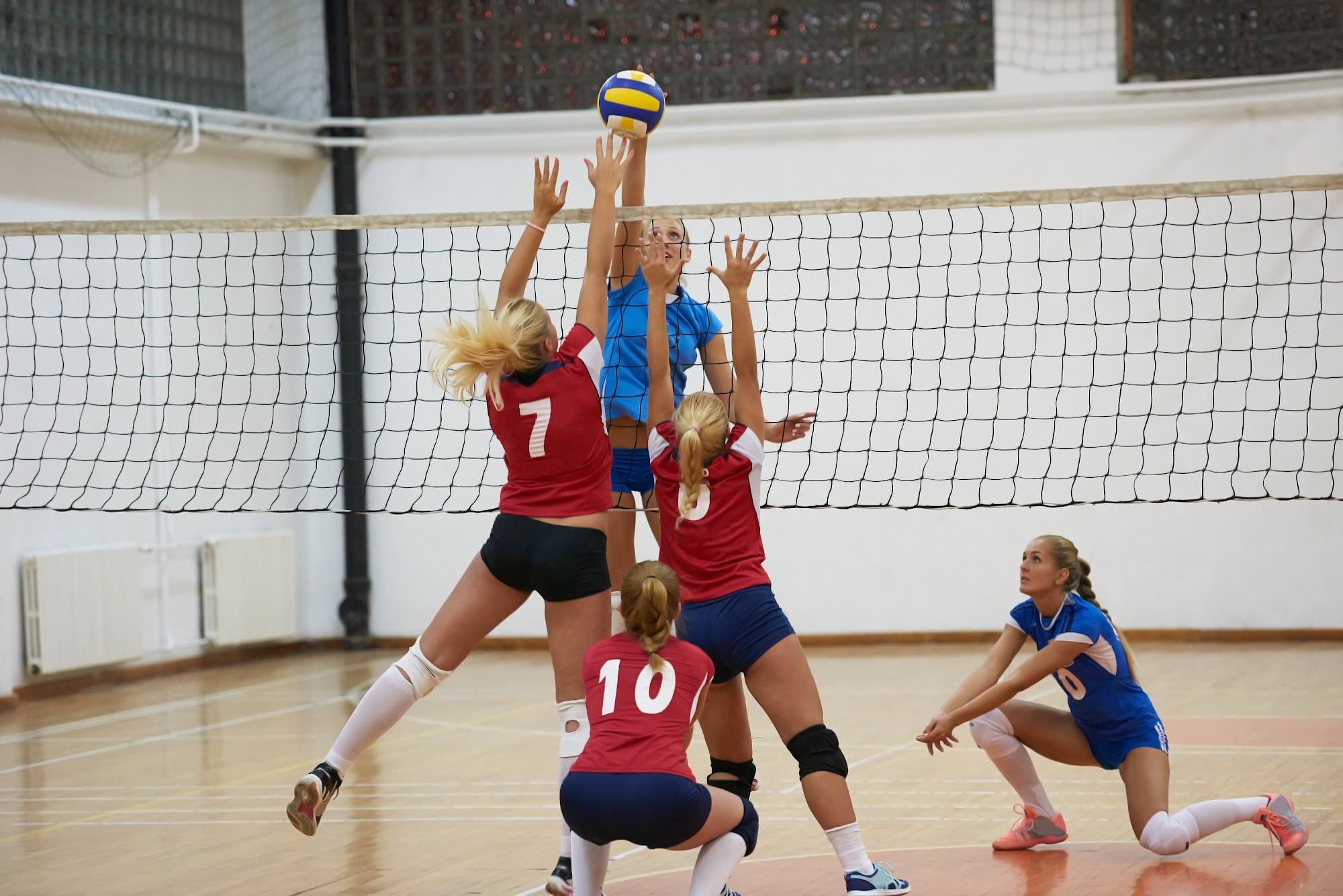 Young girls playing volleyball