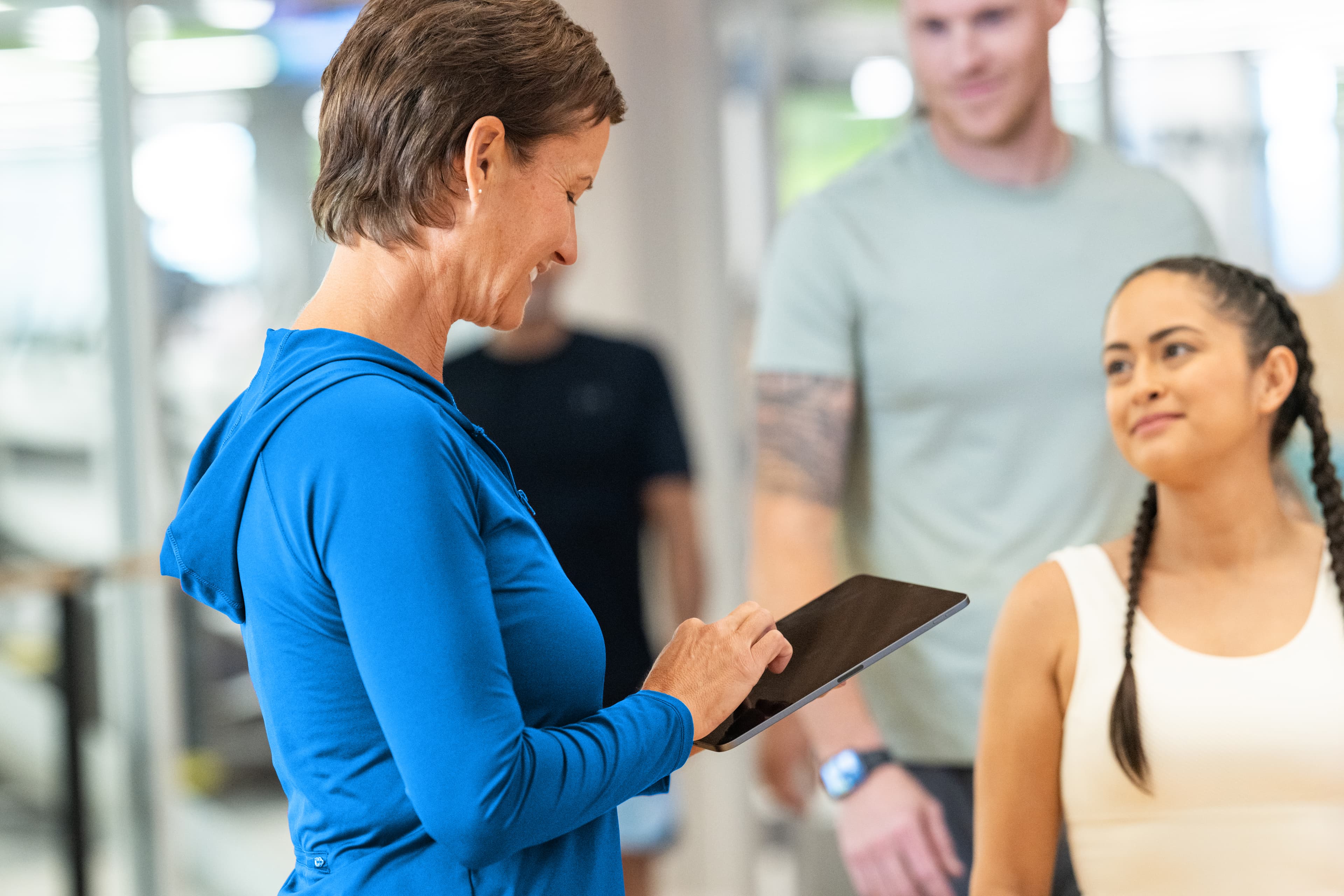 Staff managing facility schedules and program delivery using nonprofit scheduling software