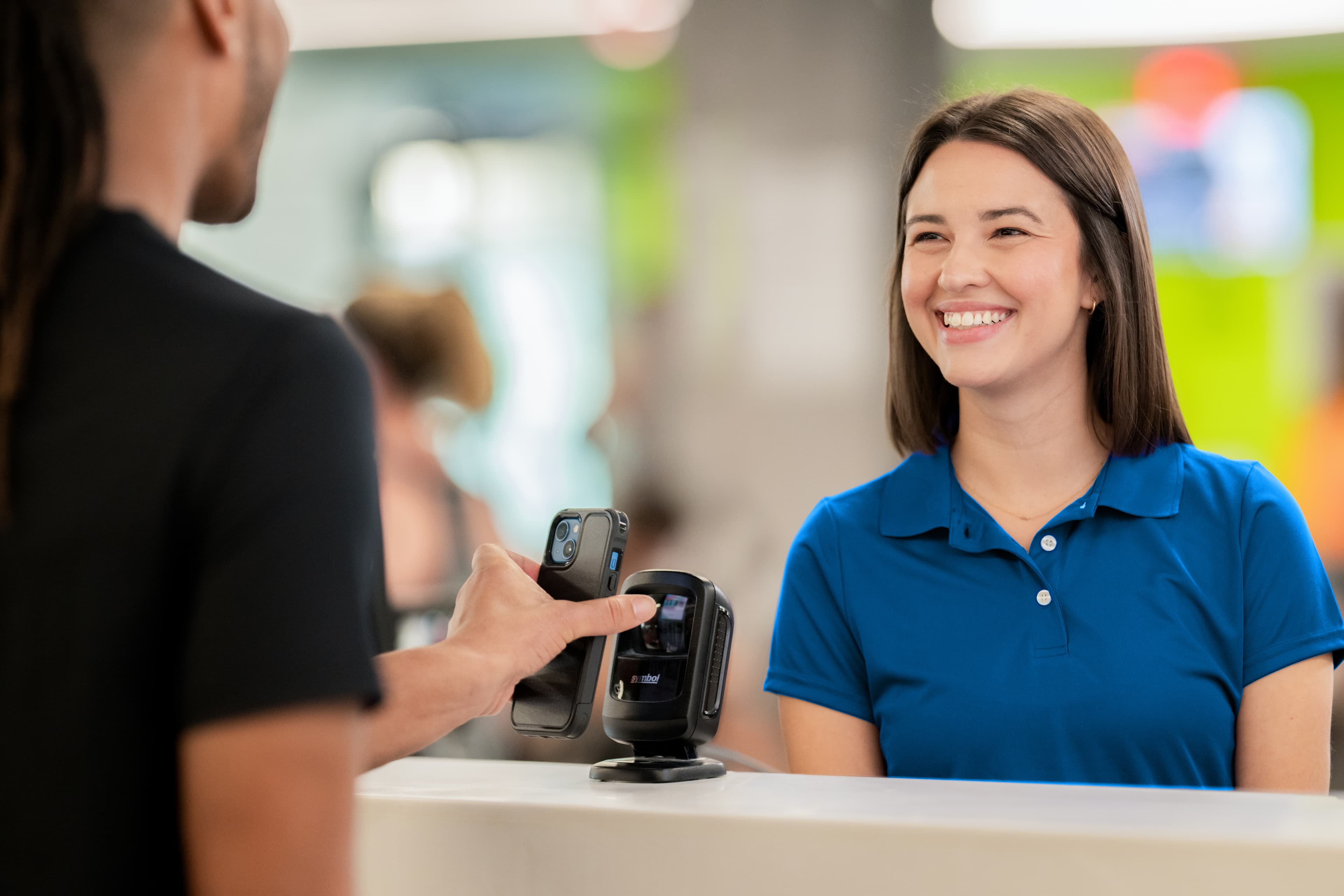 Nonprofit staff reviewing member attendance and program data dashboard to identify retention risks and improve engagement