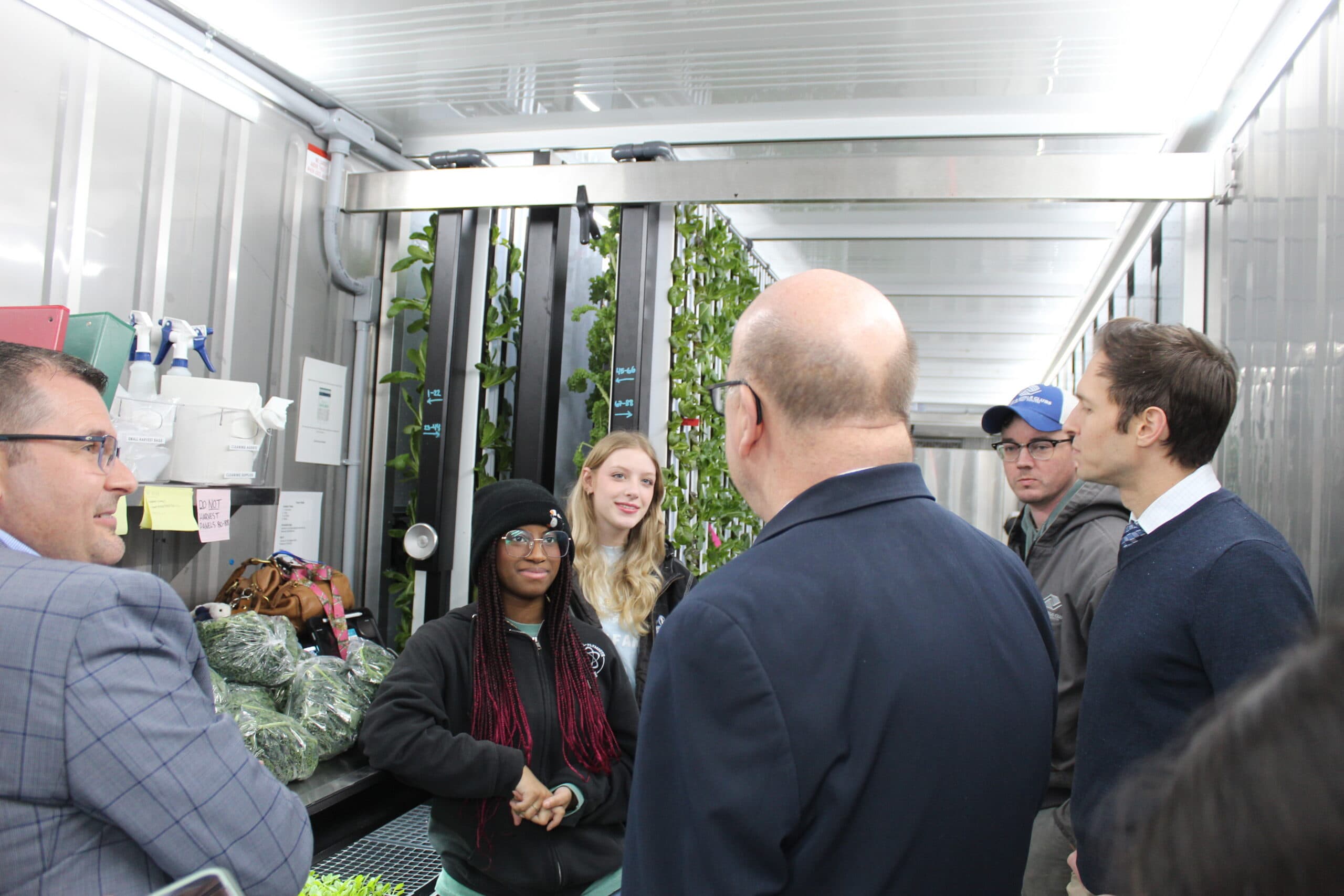 Derek Heim and congressmen touring a Freight Farms Greenery hydroponic container farm at BGC Metro South