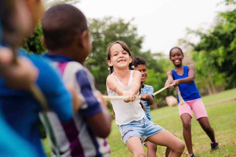 Kids playing tug of war.
