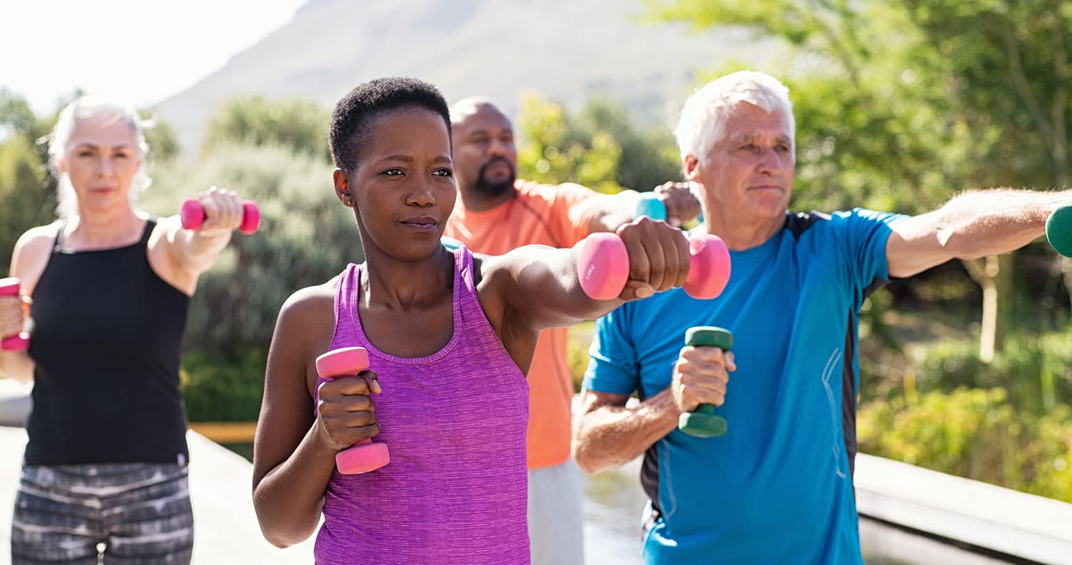 Four community members exercising together